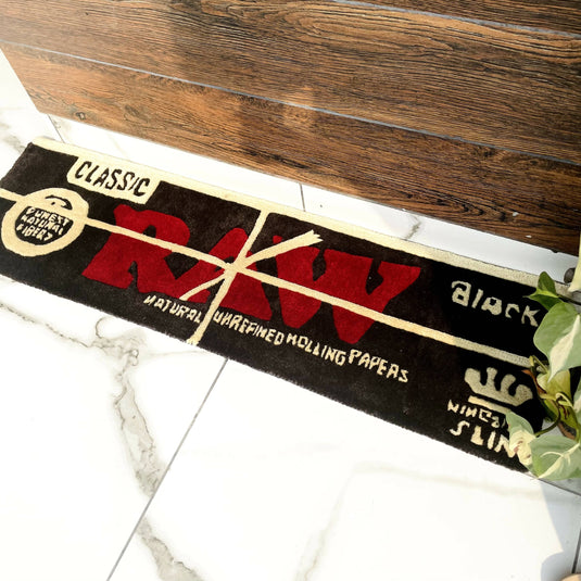 Buy Carpet Diem - Raw Rolling Papers Rug (Black) Hand-Tufted Rug | Slimjim India