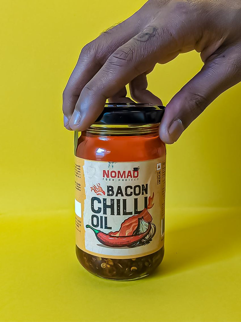 Load image into Gallery viewer, Buy Nomad Bacon Chilli Oil now online on Slimjim India
